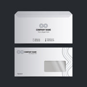 White standard envelopes, back and window front, with grey sample company branding on a dark background