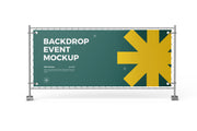 Fence banner with a green and yellow sample design fastened to a mesh fence panel on weighted feet