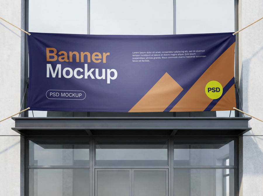 Custom size banner in navy and orange with a sample design, tied with ropes above a glass shopfront entrance