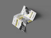 Partly opened Z-fold leaflet with a black, white and yellow wildlife sample design on grey