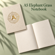 A5 elephant grass notebook with a gold Art Creators logo, beside an open copy with lined pages