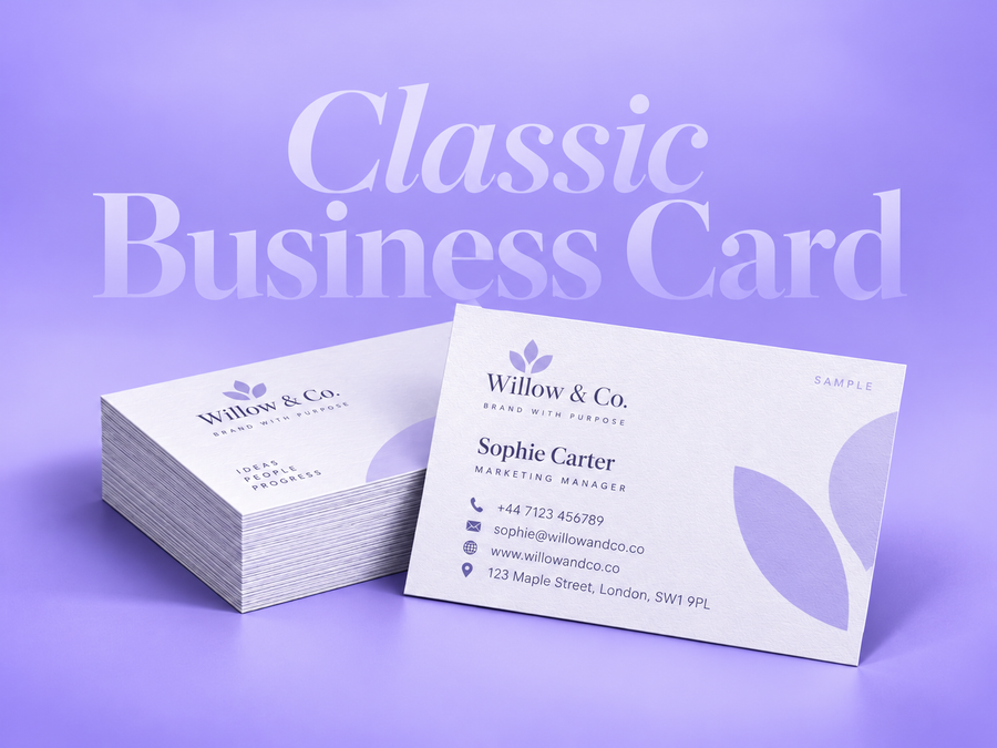 Stack of white classic business cards with a lavender leaf sample design on a lilac background