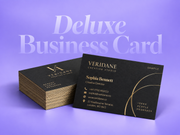 Stack of black deluxe business cards with a gold sample design on a lilac background