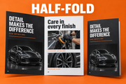 Half-fold leaflet shown open and closed with a sample car detailing design on an orange background