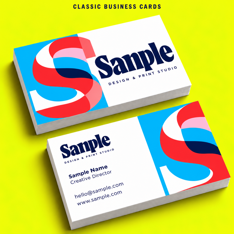 Classic business cards with colourful sample artwork on a neon yellow background